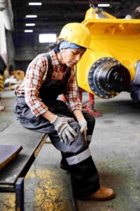 Female-Engineer-Touching-Her-Injured-Knee-After-Work-Accident