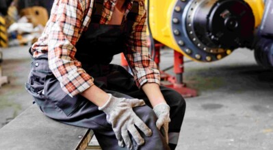 Female-Engineer-Touching-Her-Injured-Knee-After-Work-Accident