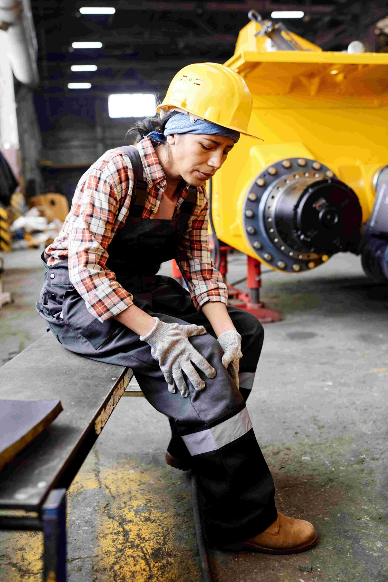Female-Engineer-Touching-Her-Injured-Knee-After-Work-Accident