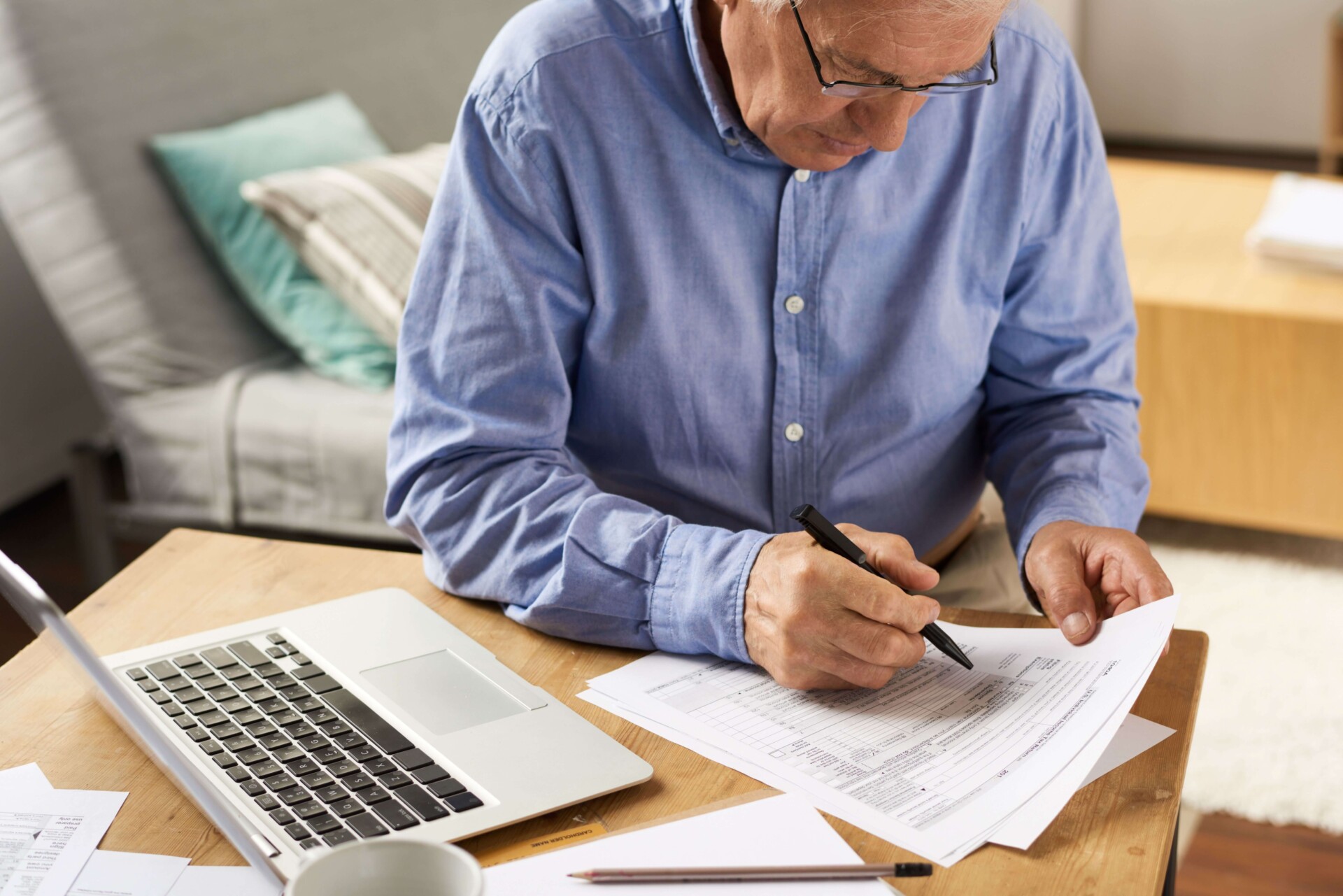 Senior-Man-Filling-Application-Form 